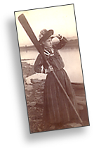 19th century woman near a sea, standing with an oar looking to the future