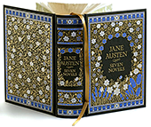 En samlingsvolym (bok) med Jane Austens sju romaner. Boken har ett vackert gammalt blommönster i vitt, svart, blått och guld.